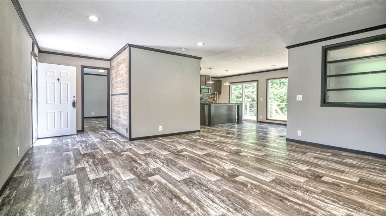 405 Lowery Road Medon, TN 38356 - Photo 6 of 24 a view of a livingroom with wooden floor and windows