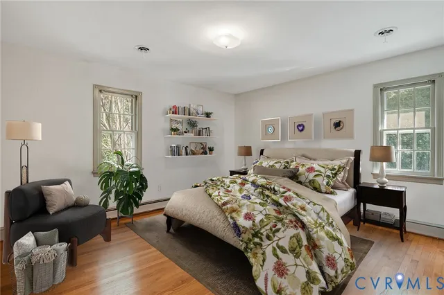 a bedroom with a bed and a couch