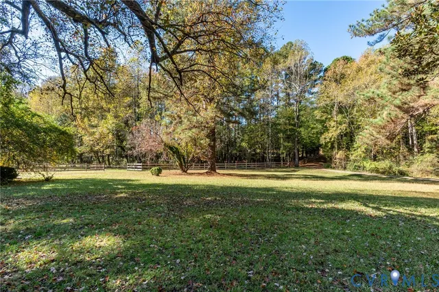 a view of field with trees in the background
