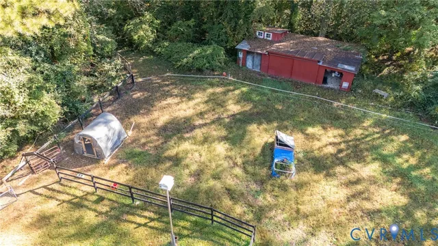 a view of a yard with large trees