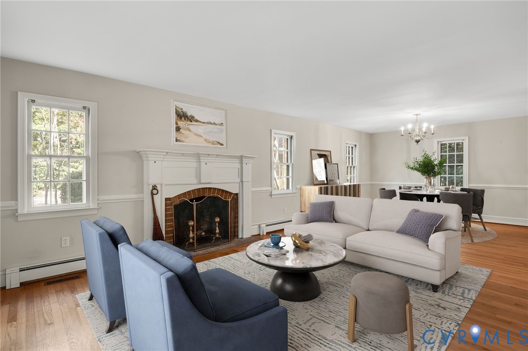 323 Church Street Wakefield, VA 23888 - Photo 7 of 50 a living room with furniture and a fireplace