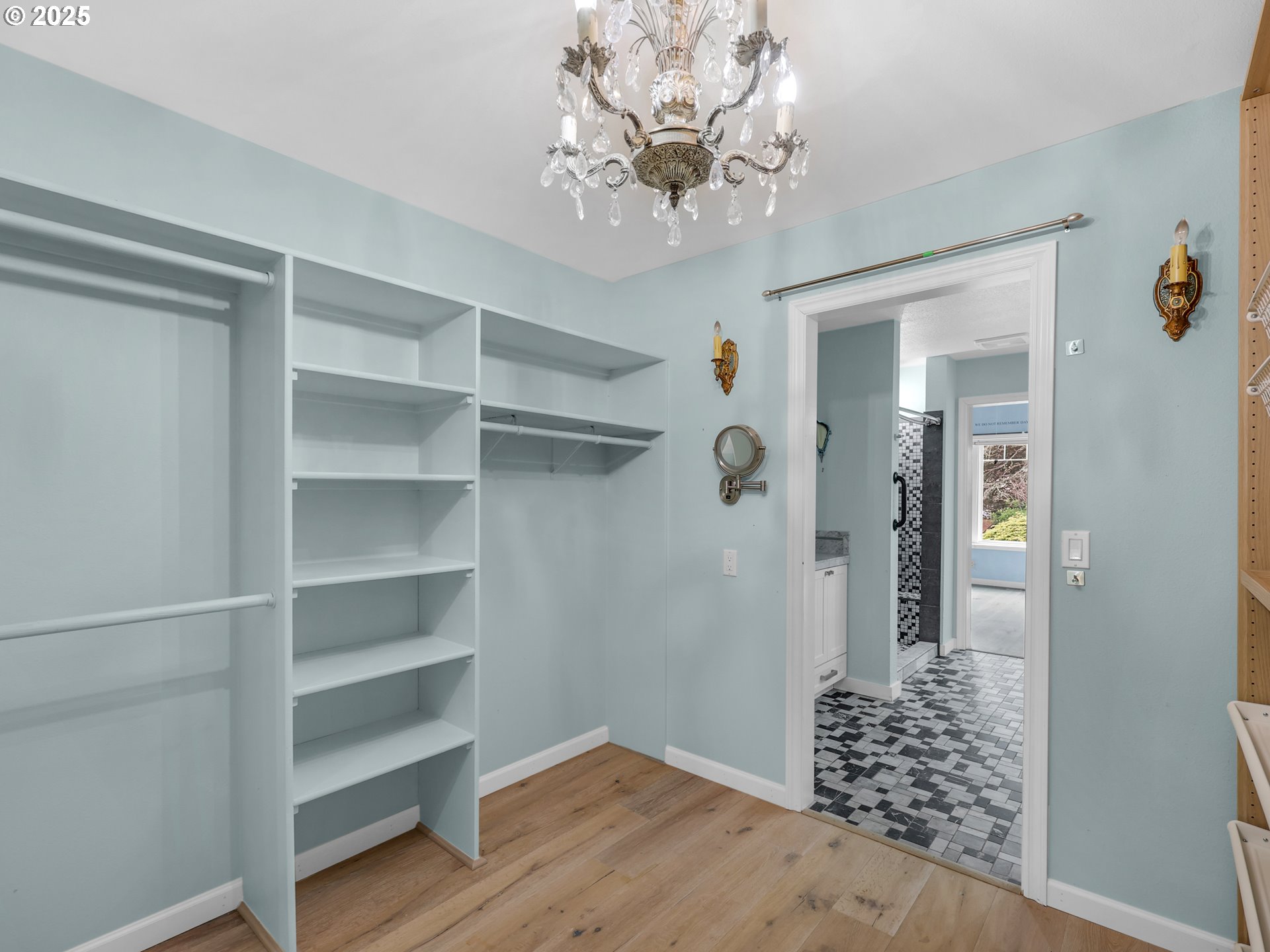 343 Hemlock Street Seaside, OR 97138 - Photo 7 of 17 a view of a hallway with wooden floor and a chandelier
