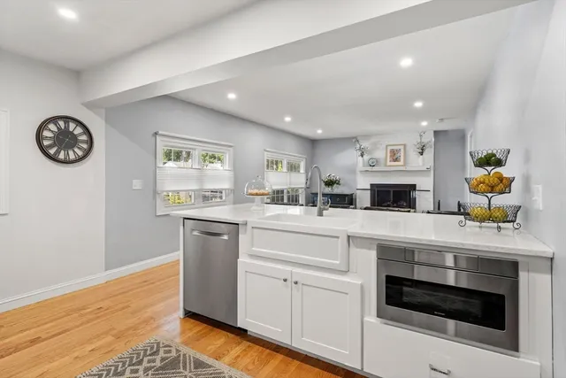 a view of a livingroom with furniture window and wooden floor
