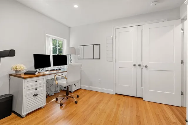 a room with chair and wooden floor