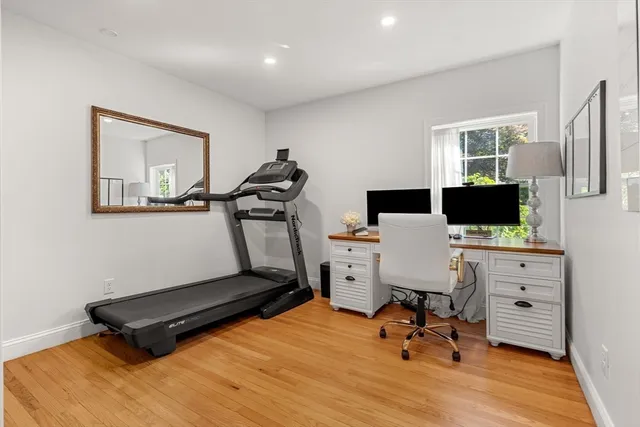 a living room with furniture rug and a table