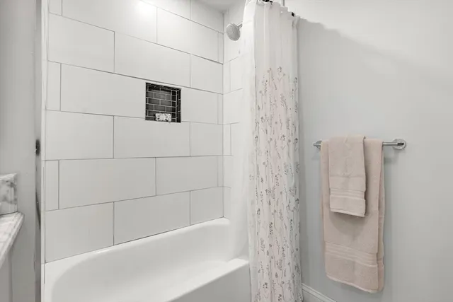 a room with stairs and pool table