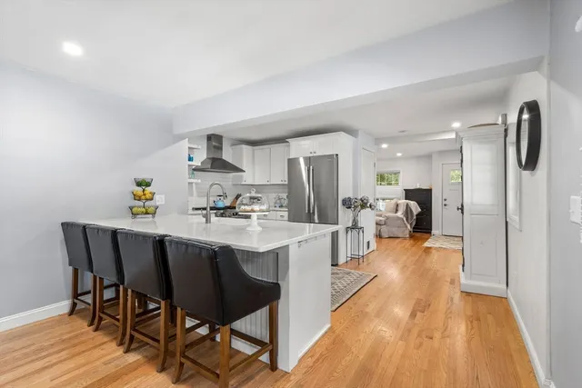 a kitchen with a stove sink and a refrigerator