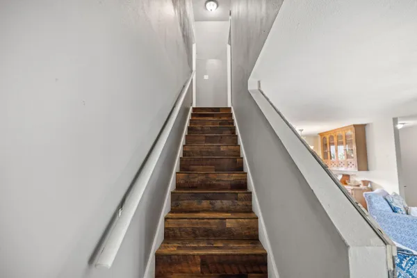 a bedroom that has a bed and a table in it