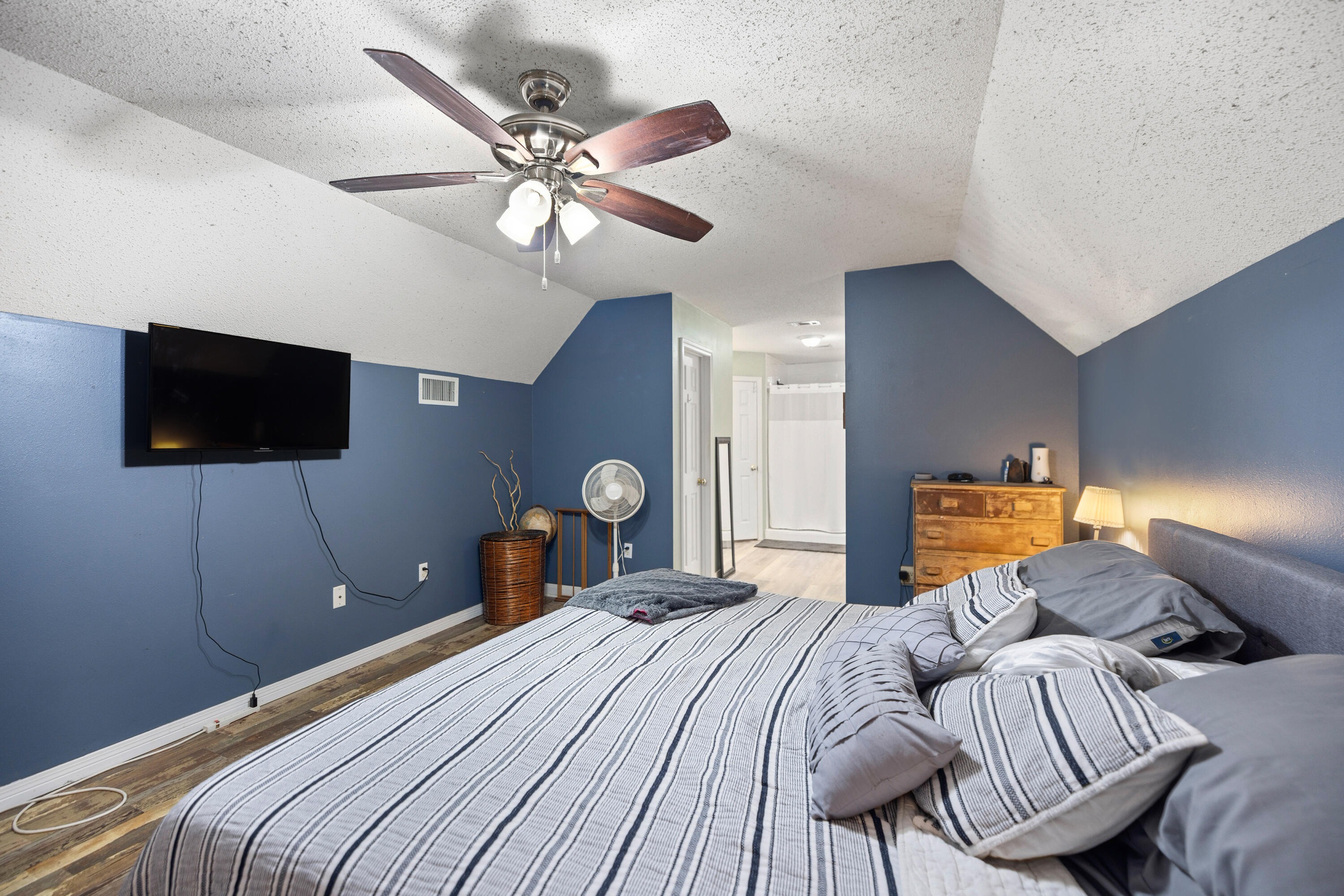 204 Warrior Street Crestview, FL 32536 - Photo 32 of 58 a bedroom with a bed and a flat screen tv