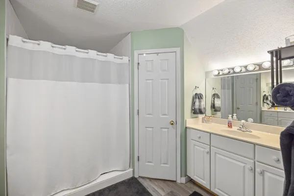 a bathroom with a double vanity sink and mirror