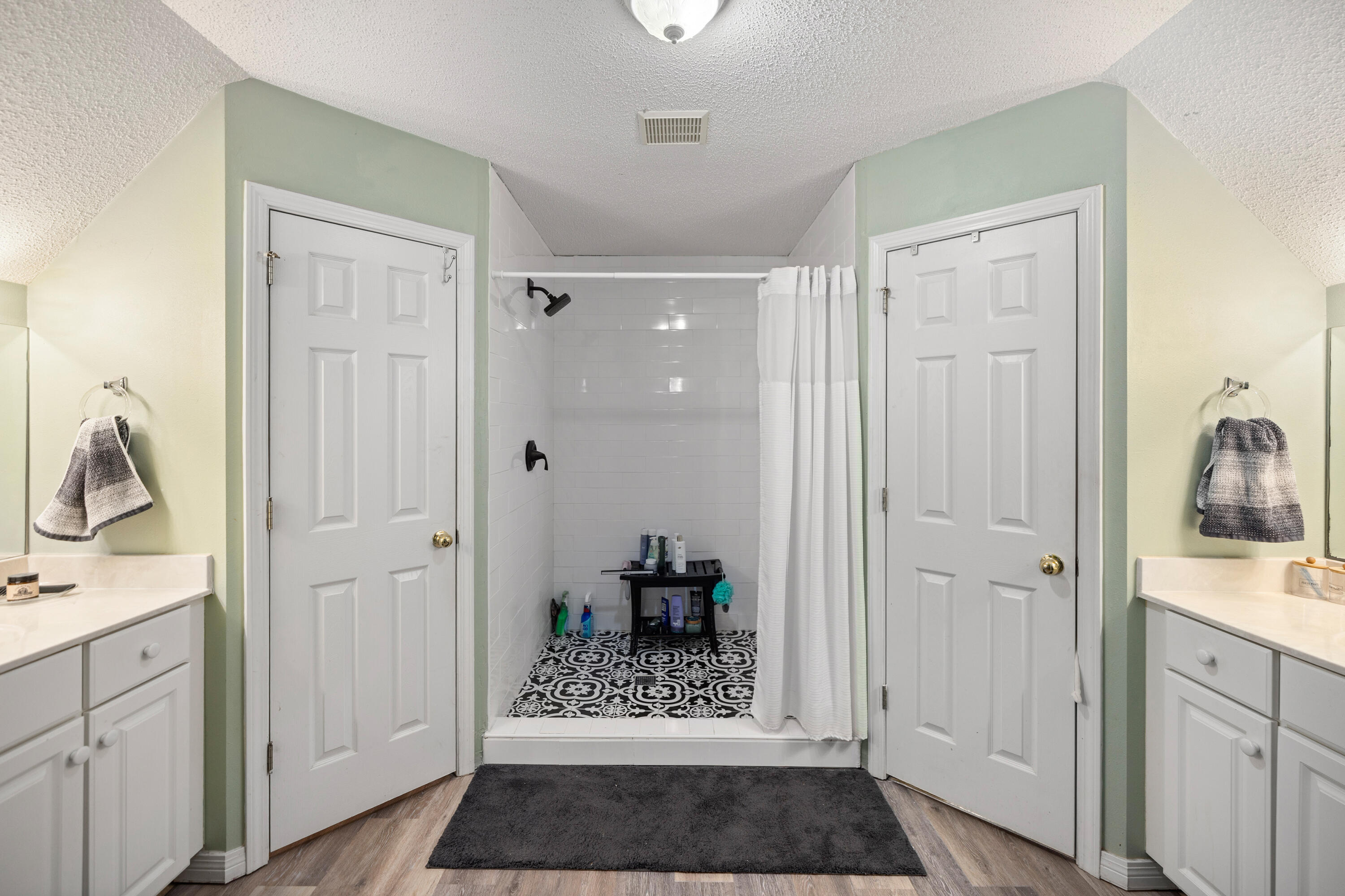 204 Warrior Street Crestview, FL 32536 - Photo 35 of 58 a view of bathroom with a sink mirror and shower