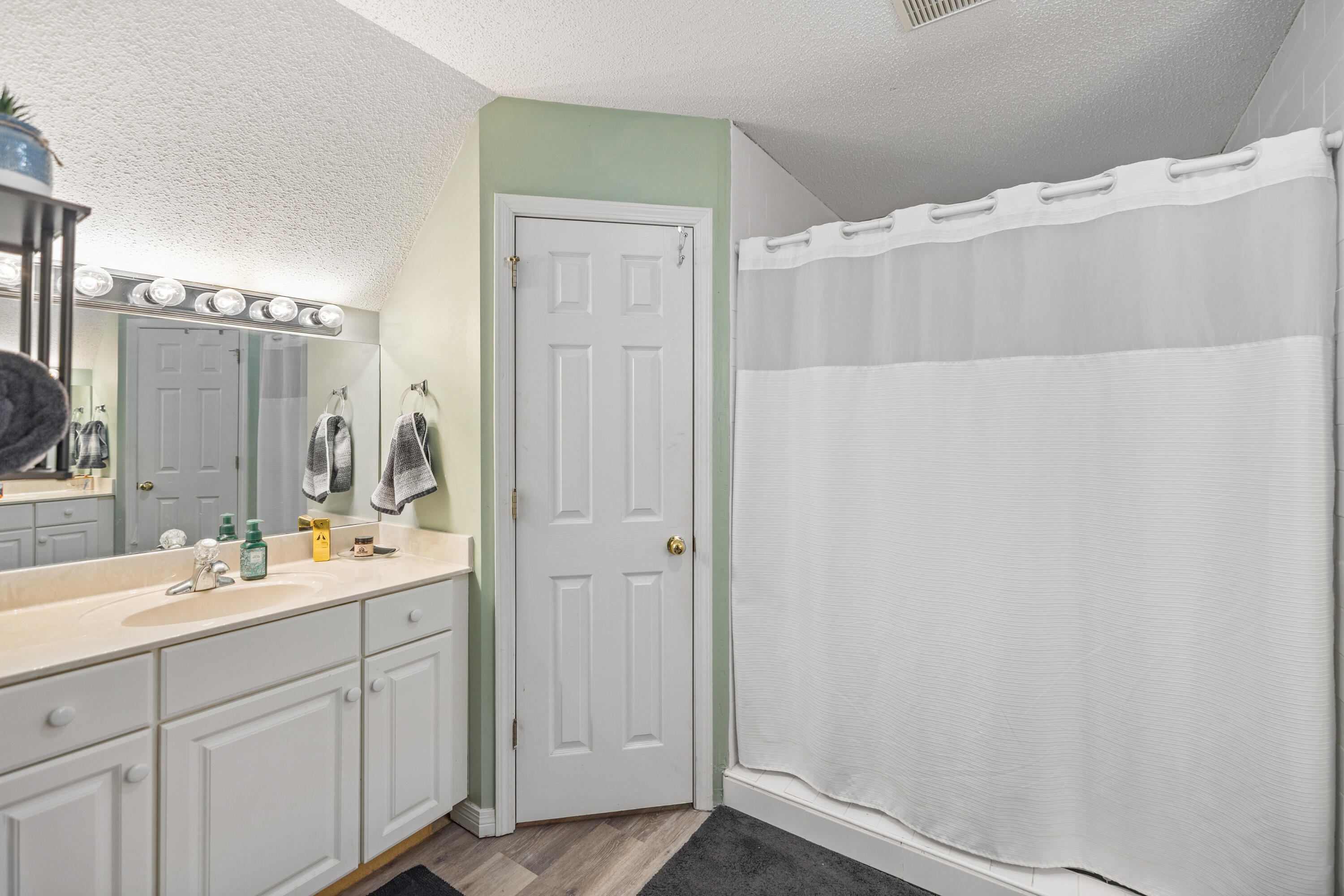 204 Warrior Street Crestview, FL 32536 - Photo 37 of 58 a bathroom with a double vanity sink and mirror