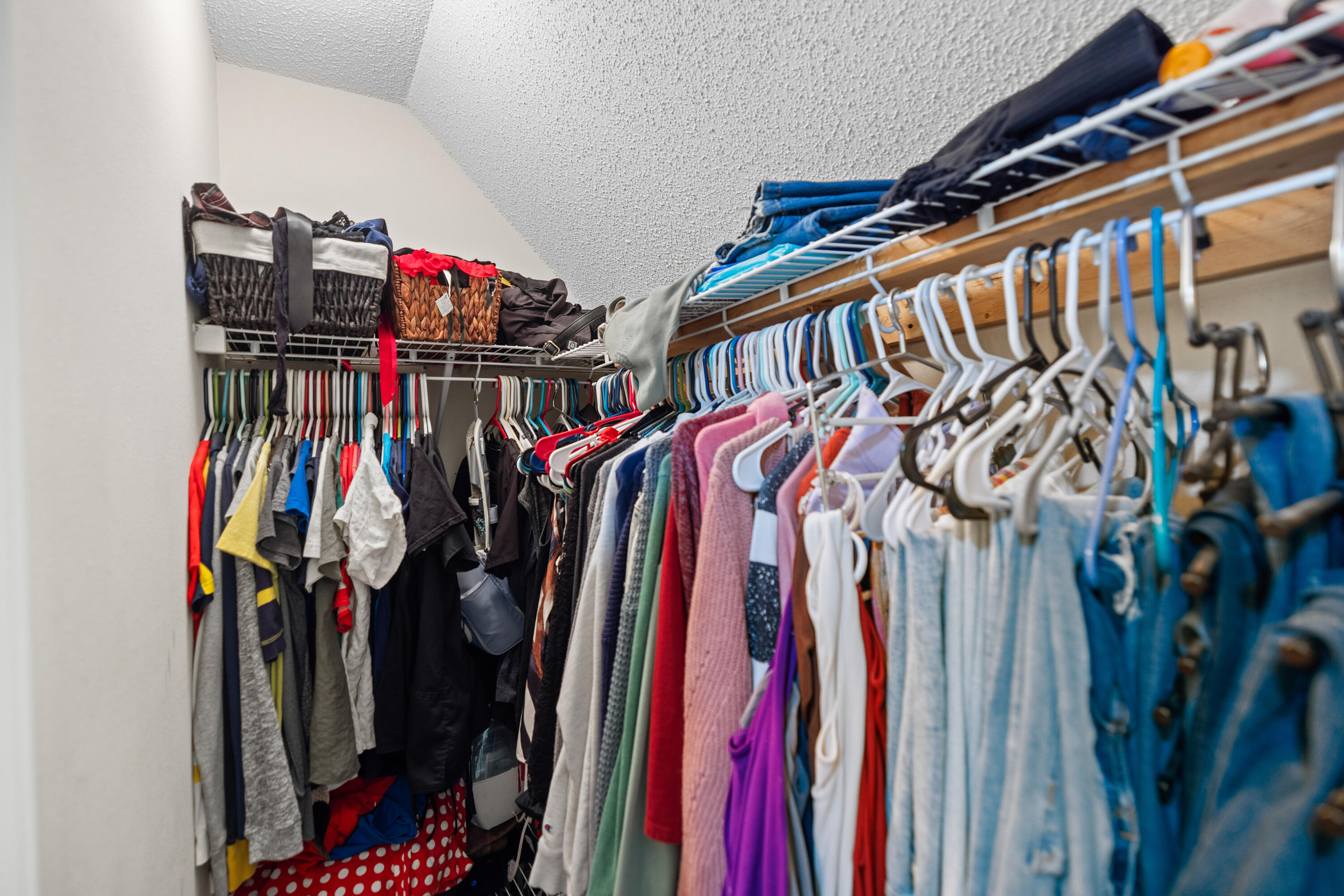 204 Warrior Street Crestview, FL 32536 - Photo 38 of 58 a view of walk in closet with clothes