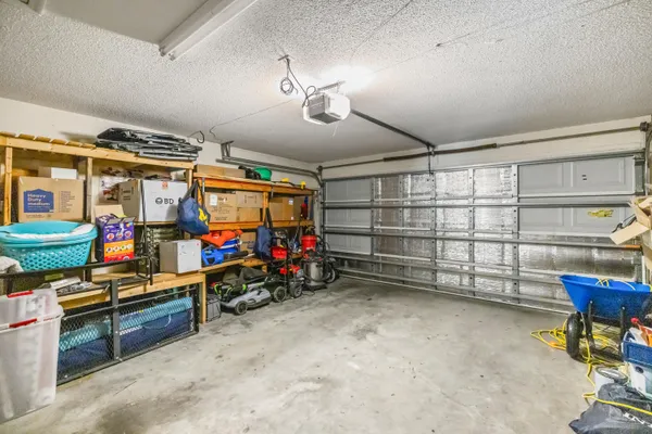 a view of a balcony with a large window and wooden floor