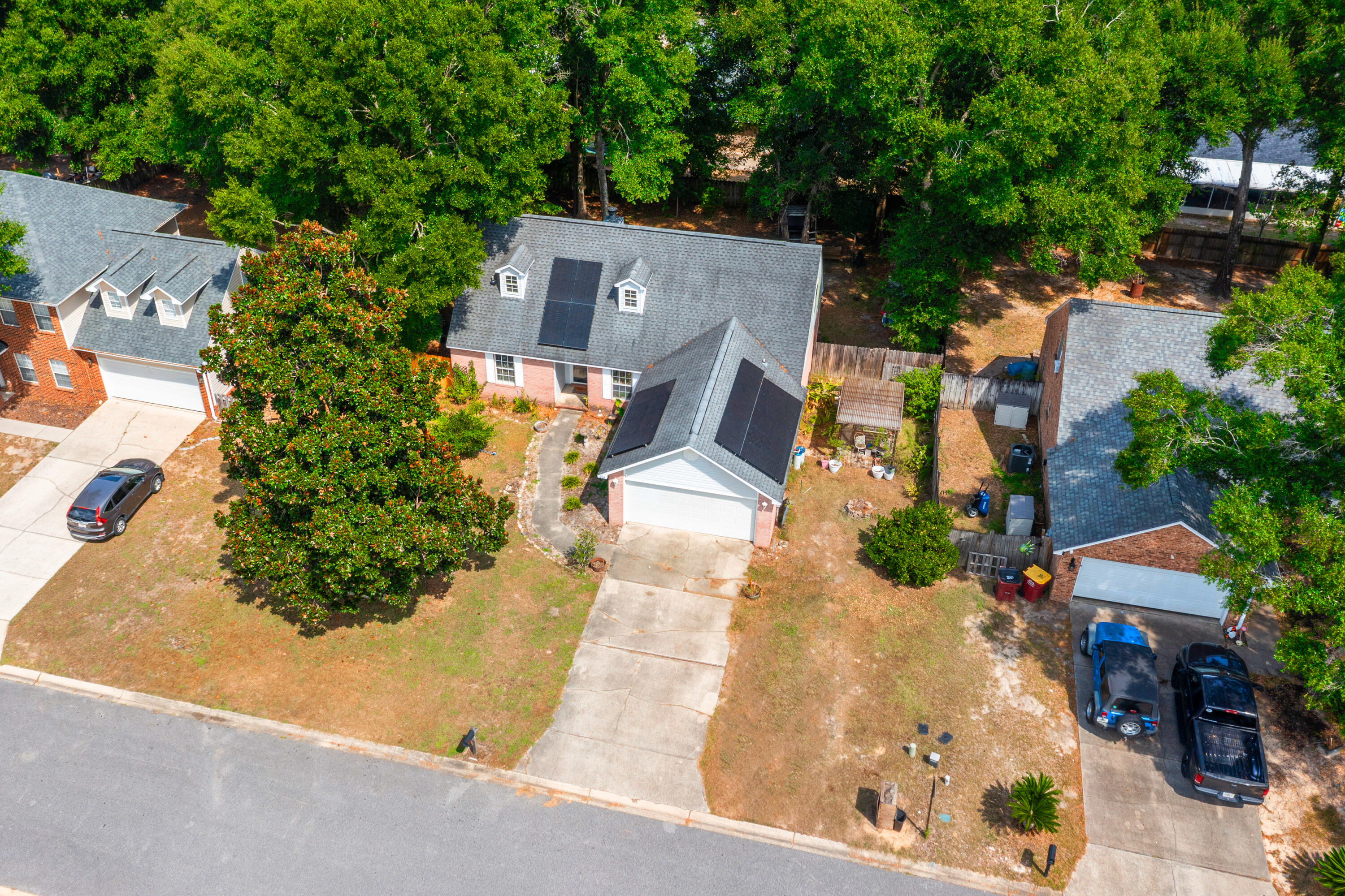 204 Warrior Street Crestview, FL 32536 - Photo 52 of 59 an aerial view of a house with garden space and street view