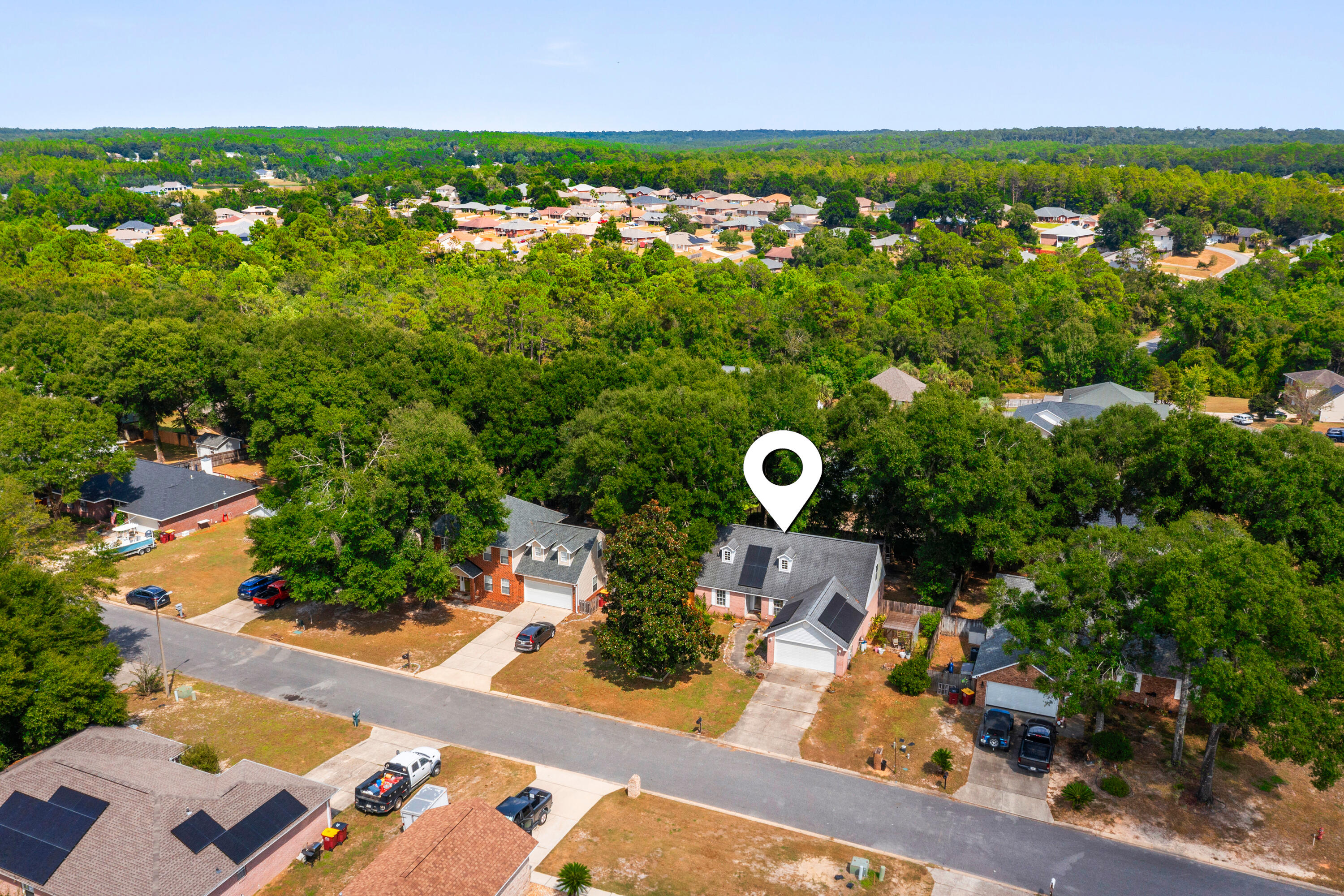 204 Warrior Street Crestview, FL 32536 - Photo 54 of 58 an aerial view of a house with a yard