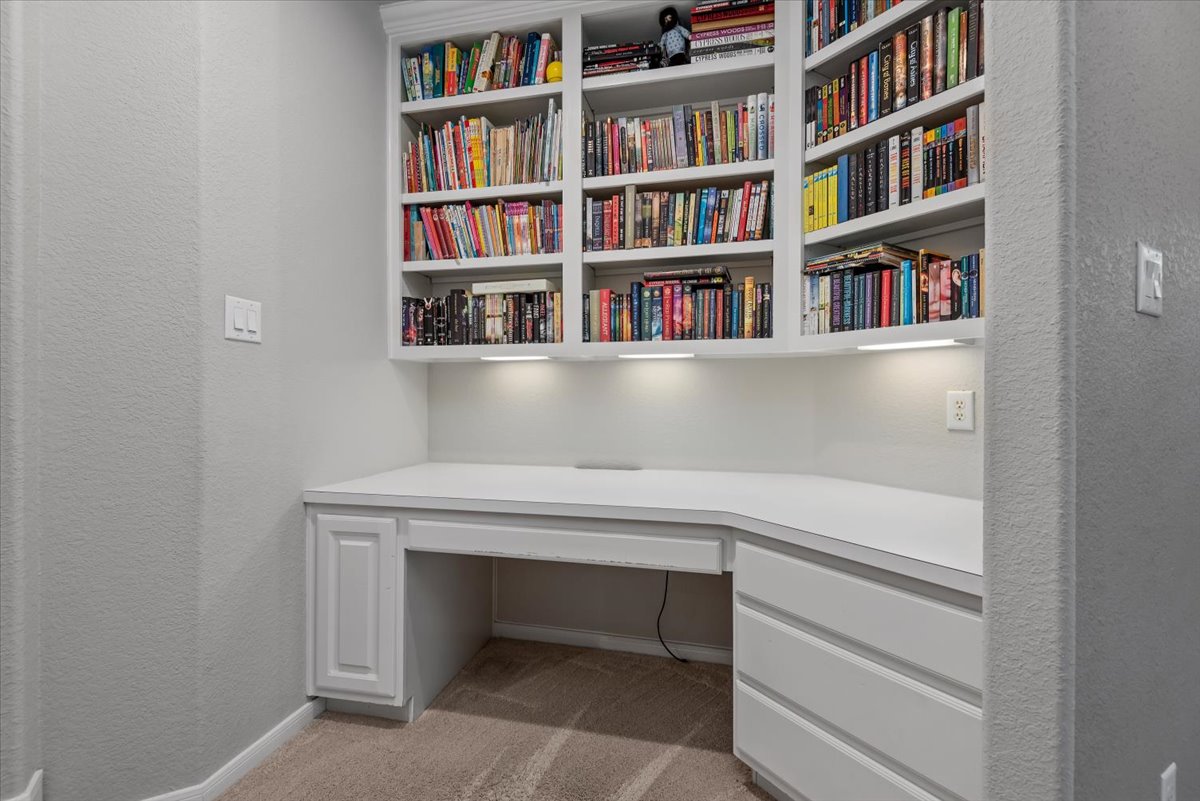 15519 Stallion Point Circle Cypress, TX 77429 - Photo 28 of 37 Built-in desk and shelving unit with integrated lighting