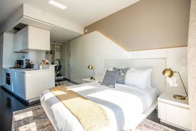 a bathroom with a toilet sink shower and mirror