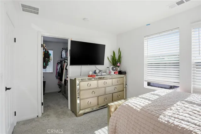 a bathroom with double vanity sink toilet and shower