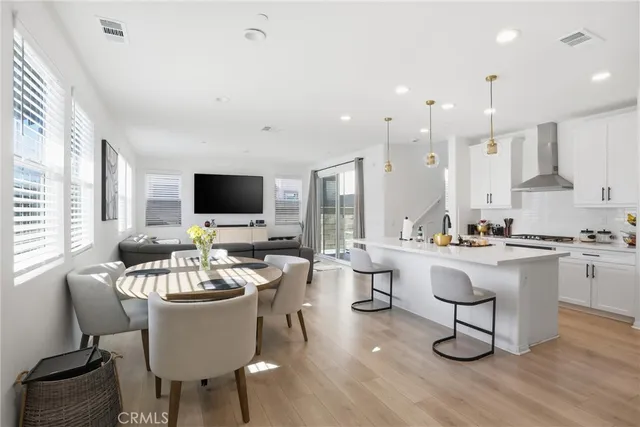 a view of a dining room with furniture and window