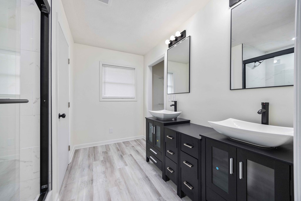 6270 Mill Branch Road Columbus, GA 31907 - Photo 17 of 25 a bathroom with a double vanity sink and a mirror