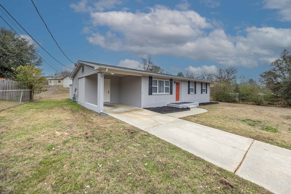 6270 Mill Branch Road Columbus, GA 31907 - Photo 2 of 25 a front view of house with yard and trees around