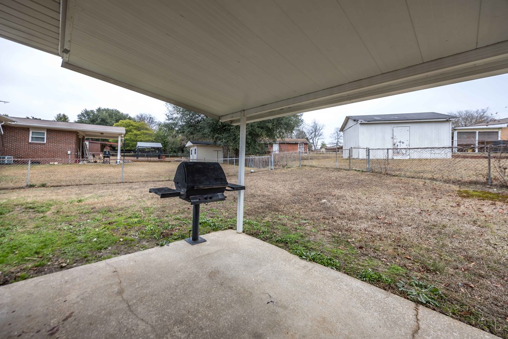 6270 Mill Branch Road Columbus, GA 31907 - Photo 25 of 25 a view of a backyard with table and chairs
