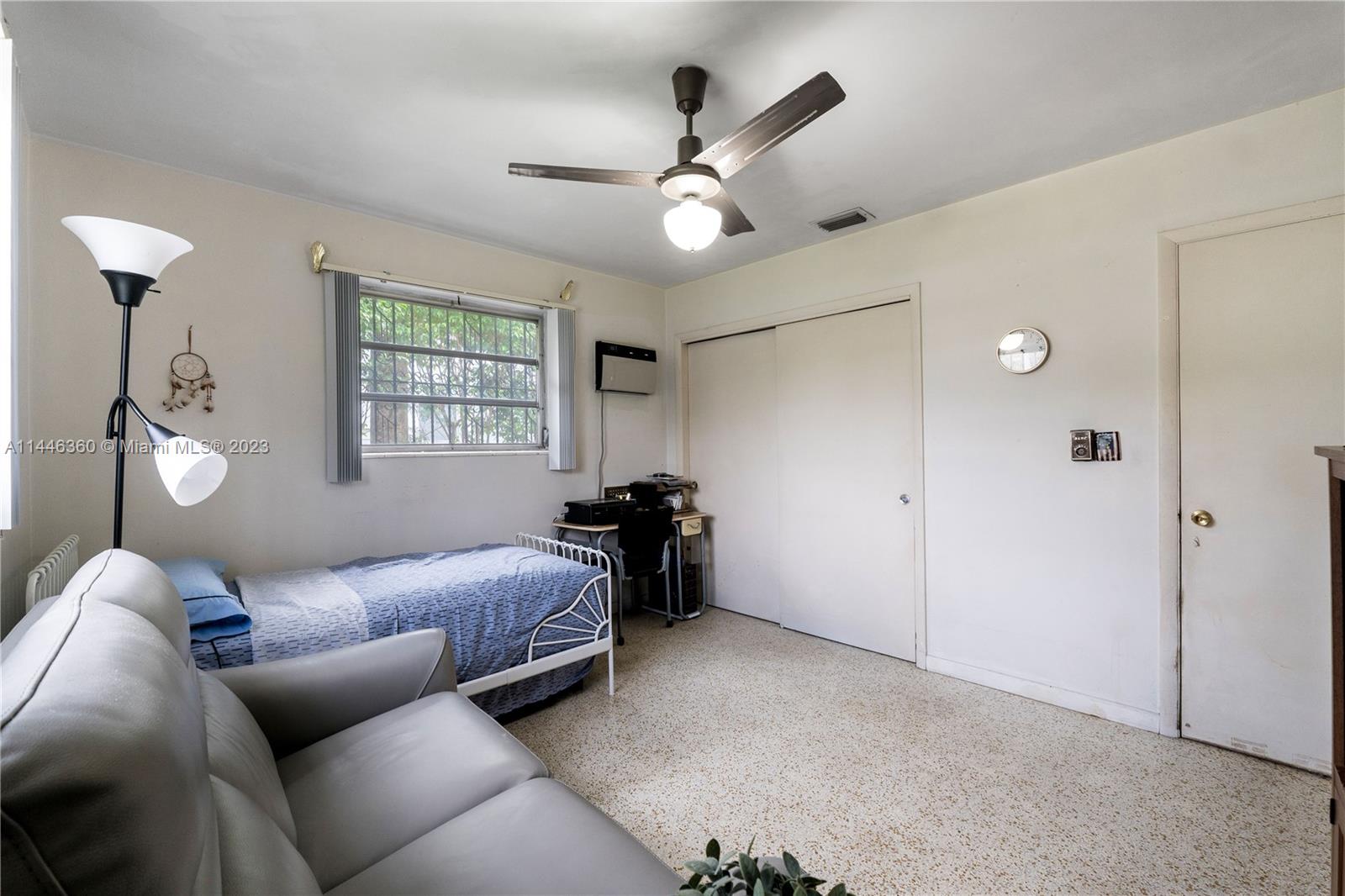 2446 Southwest 15th Street Miami, FL 33145 - Photo 18 of 42 a living room with furniture and a window
