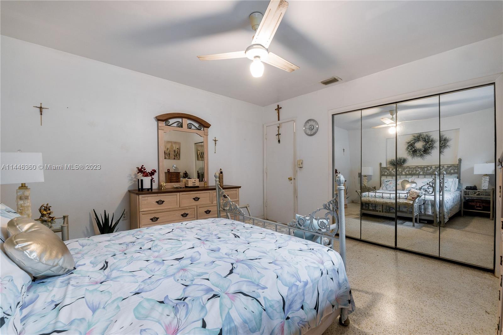 2446 Southwest 15th Street Miami, FL 33145 - Photo 22 of 42 a bedroom with a bed and a mirror