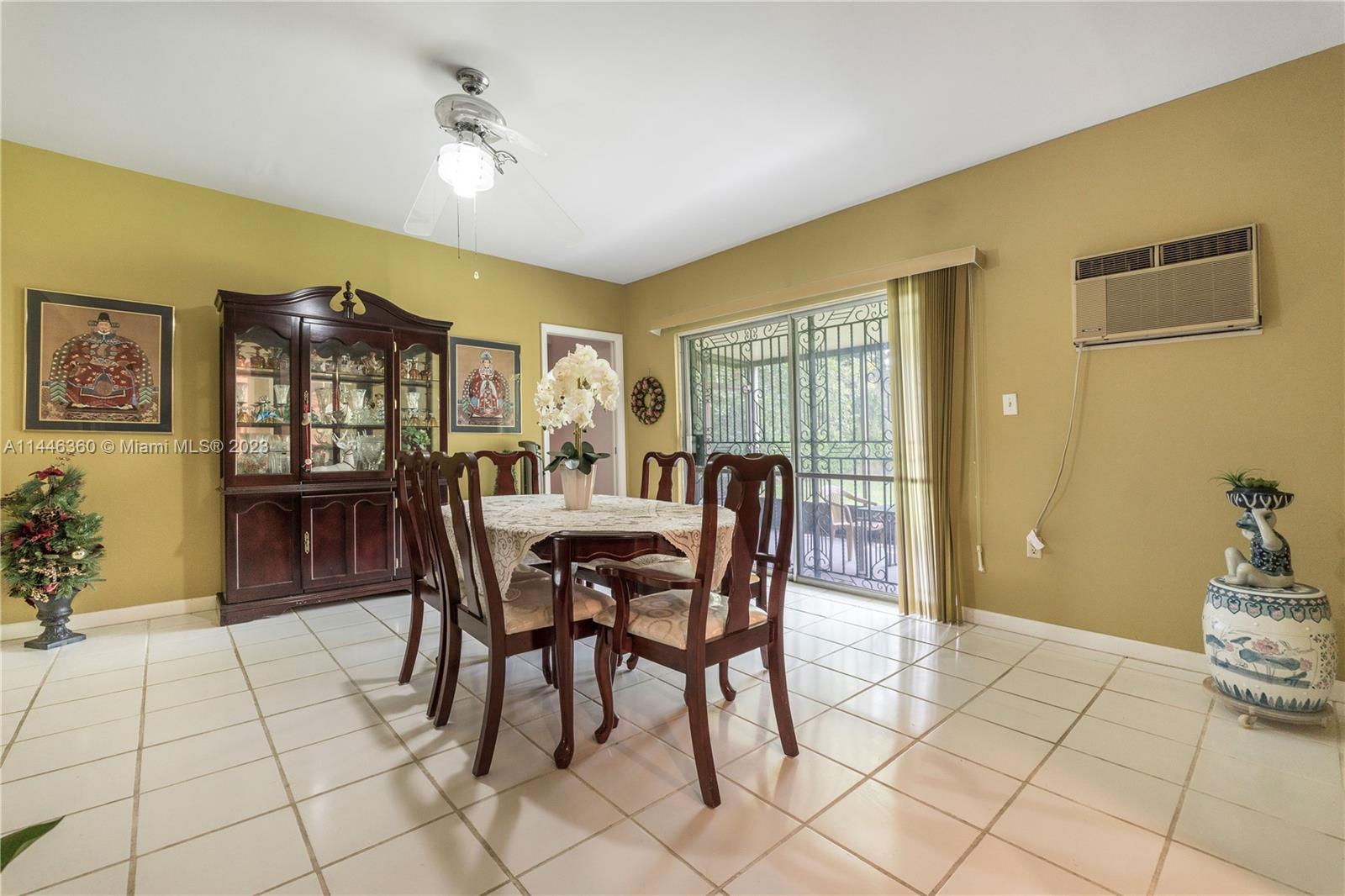 2446 Southwest 15th Street Miami, FL 33145 - Photo 24 of 42 a view of a dining room with furniture and chandelier