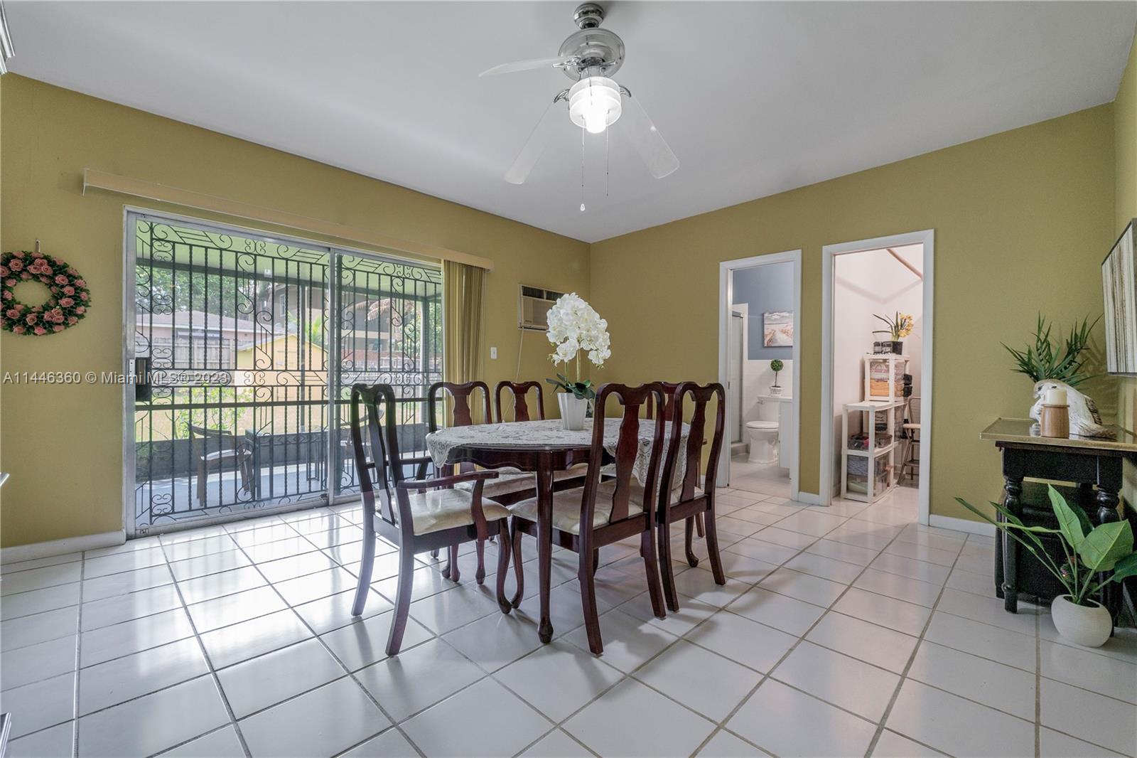 2446 Southwest 15th Street Miami, FL 33145 - Photo 25 of 42 a view of a dining room with furniture and chandelier