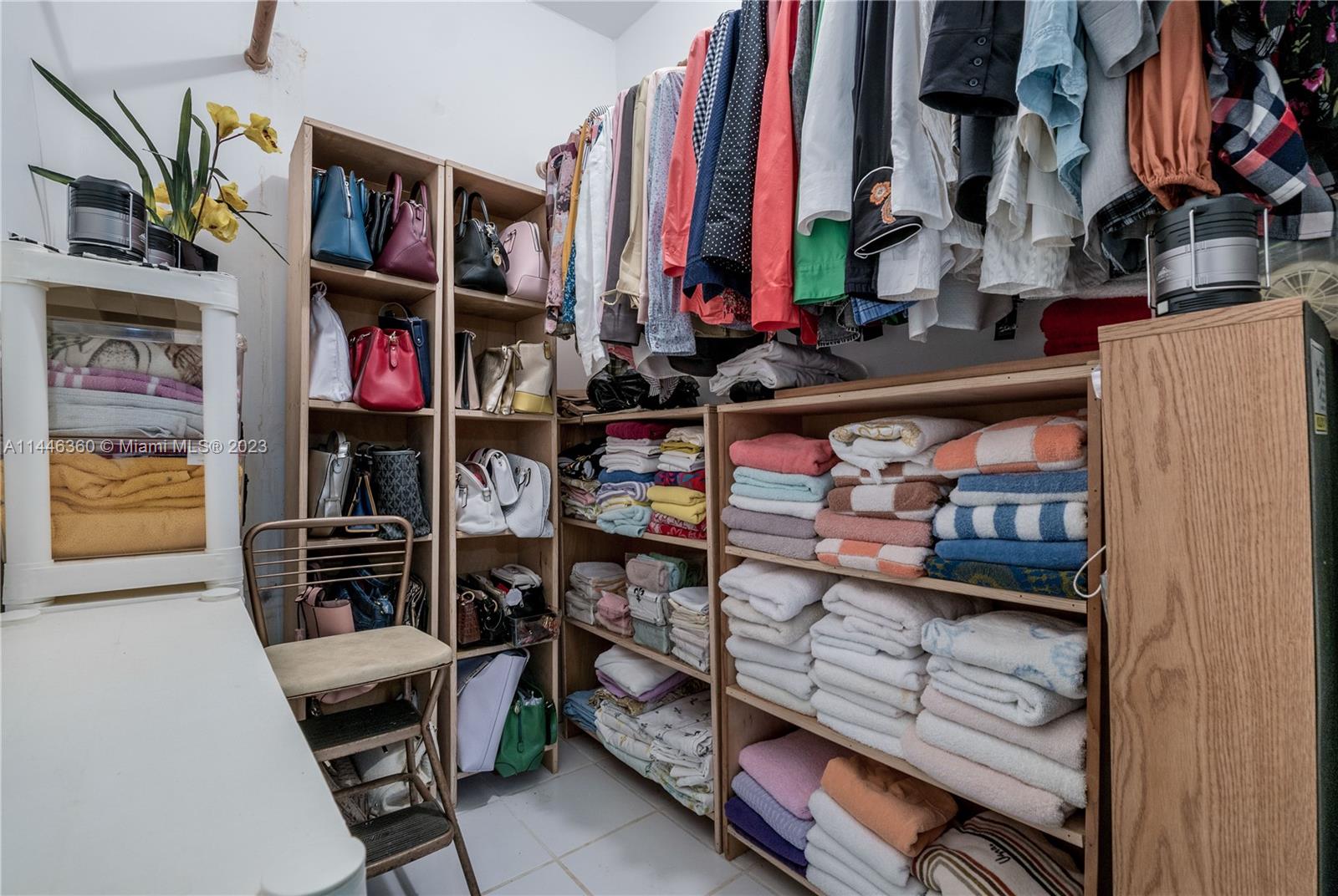 2446 Southwest 15th Street Miami, FL 33145 - Photo 26 of 42 a view of walk in closet with clothes and shoes