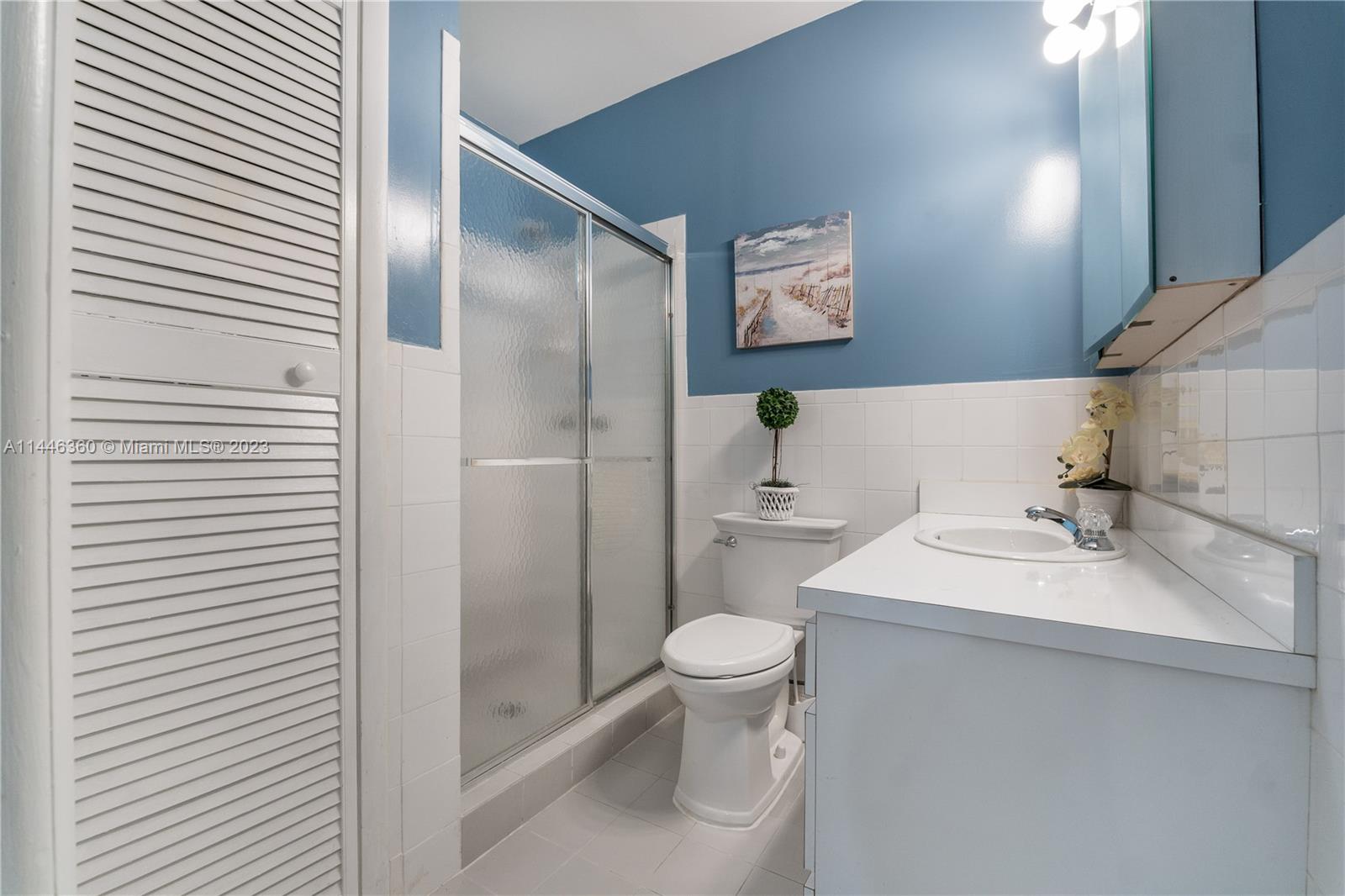 2446 Southwest 15th Street Miami, FL 33145 - Photo 27 of 42 a bathroom with a sink toilet and shower