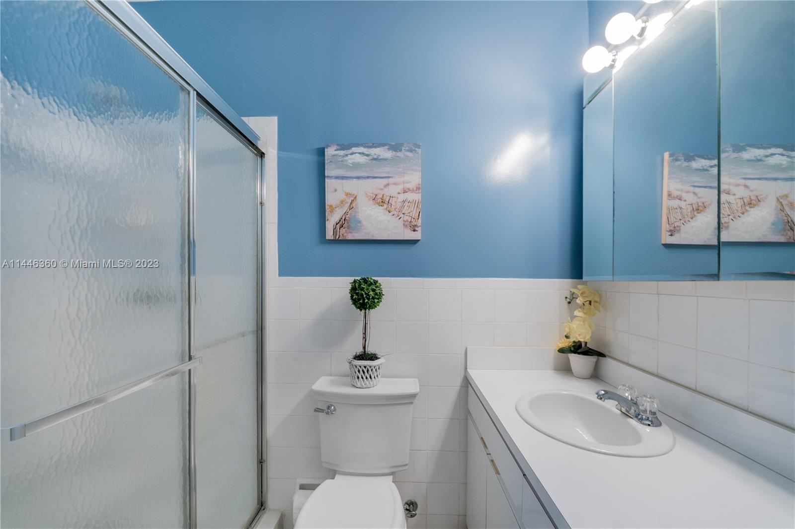 2446 Southwest 15th Street Miami, FL 33145 - Photo 29 of 42 a bathroom with a sink toilet and mirror