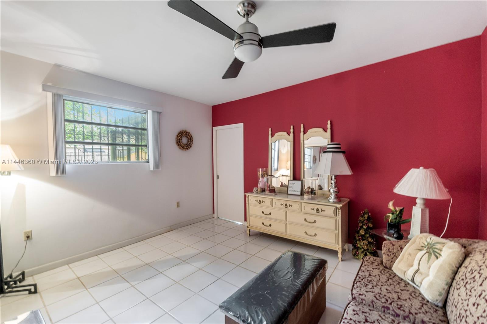2446 Southwest 15th Street Miami, FL 33145 - Photo 32 of 42 a bed room with a bed and a mirror