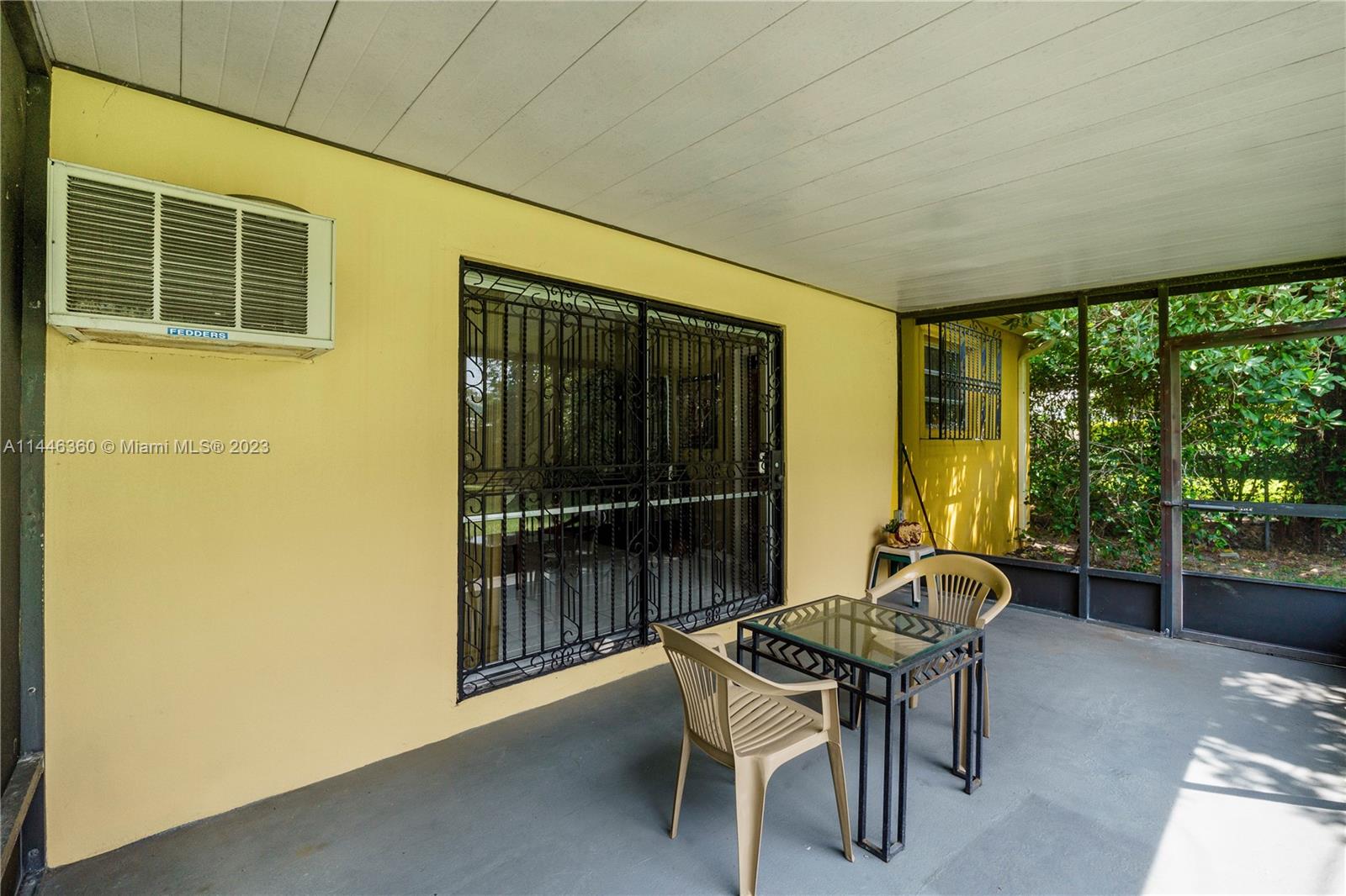 2446 Southwest 15th Street Miami, FL 33145 - Photo 33 of 42 a patio with table and chairs