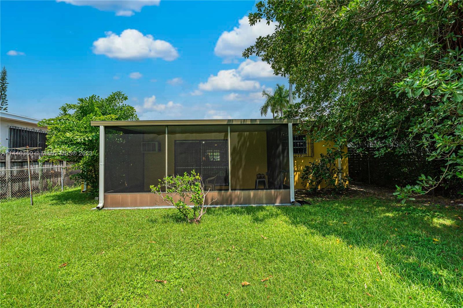 2446 Southwest 15th Street Miami, FL 33145 - Photo 39 of 42 a view of a chair and table in backyard of the house