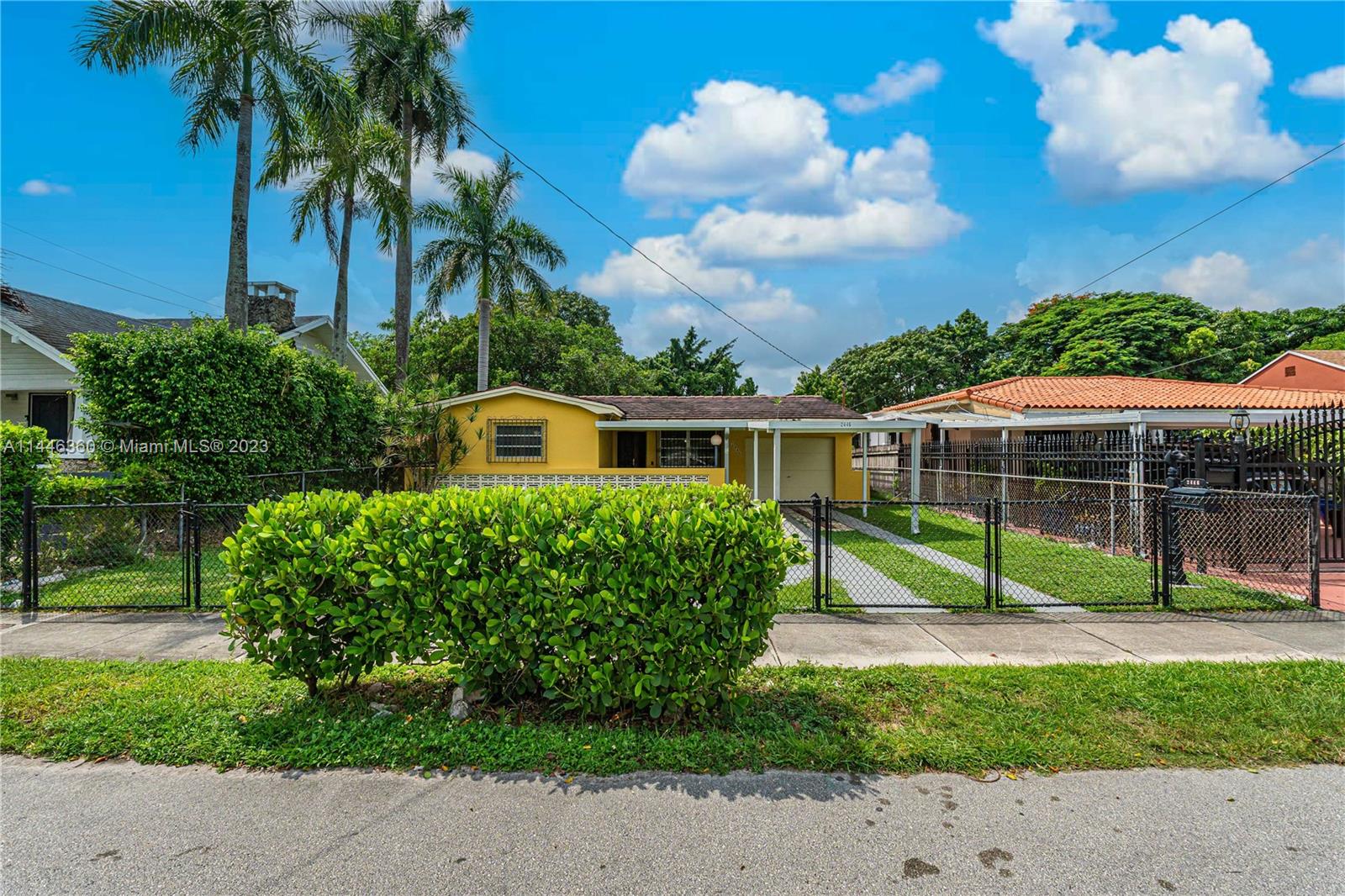 2446 Southwest 15th Street Miami, FL 33145 - Photo 41 of 42 a front view of a house with garden