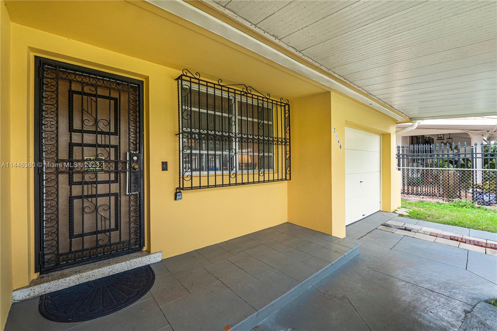 2446 Southwest 15th Street Miami, FL 33145 - Photo 6 of 42 a front view of a house with a yard