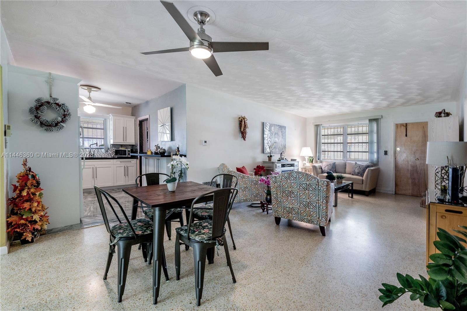 2446 Southwest 15th Street Miami, FL 33145 - Photo 10 of 42 a view of a dining room with furniture and chandelier