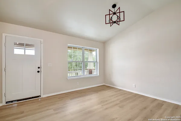 a view of an empty room with a window