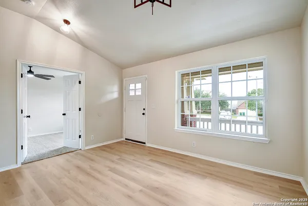 a view of an empty room with a window