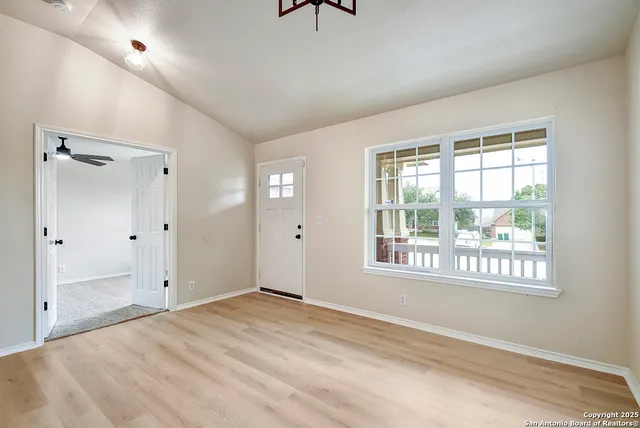 a view of an empty room with a window