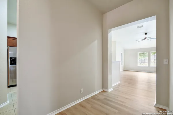 a view of empty room with windows