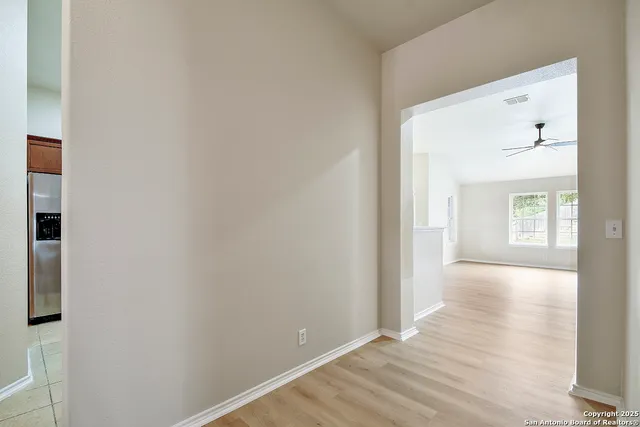 a view of empty room with windows