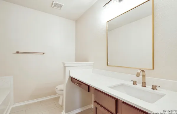a white bath tub sitting in a bathroom