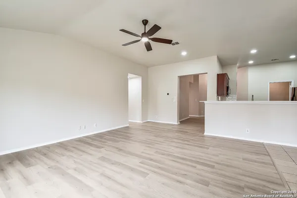 a kitchen with kitchen island a sink and a refrigerator