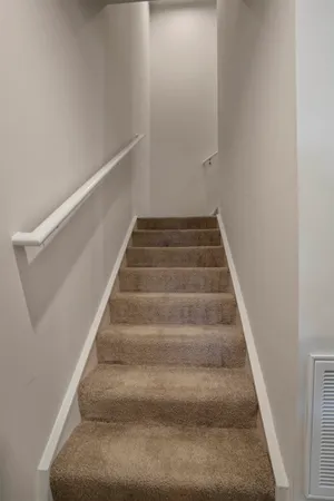 a bedroom with a bed and a table