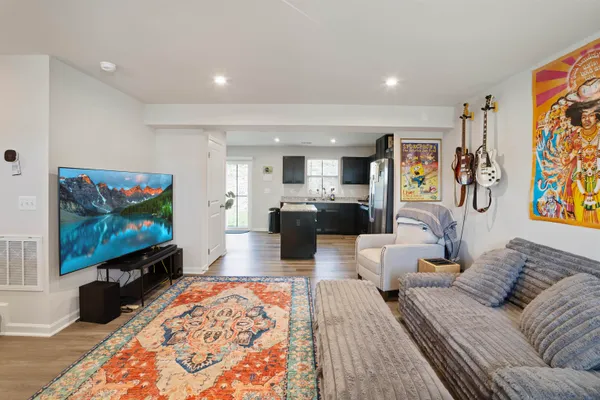 a living room with furniture and a rug