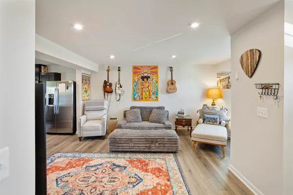 a living room with furniture and a rug